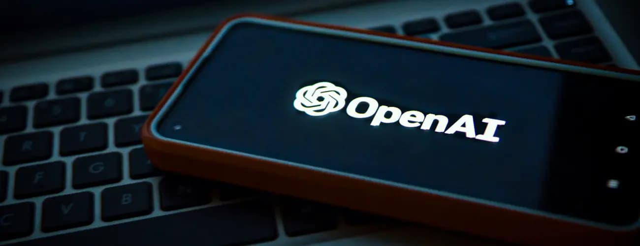 Mobile Device With Text And Logo Of OpenAI